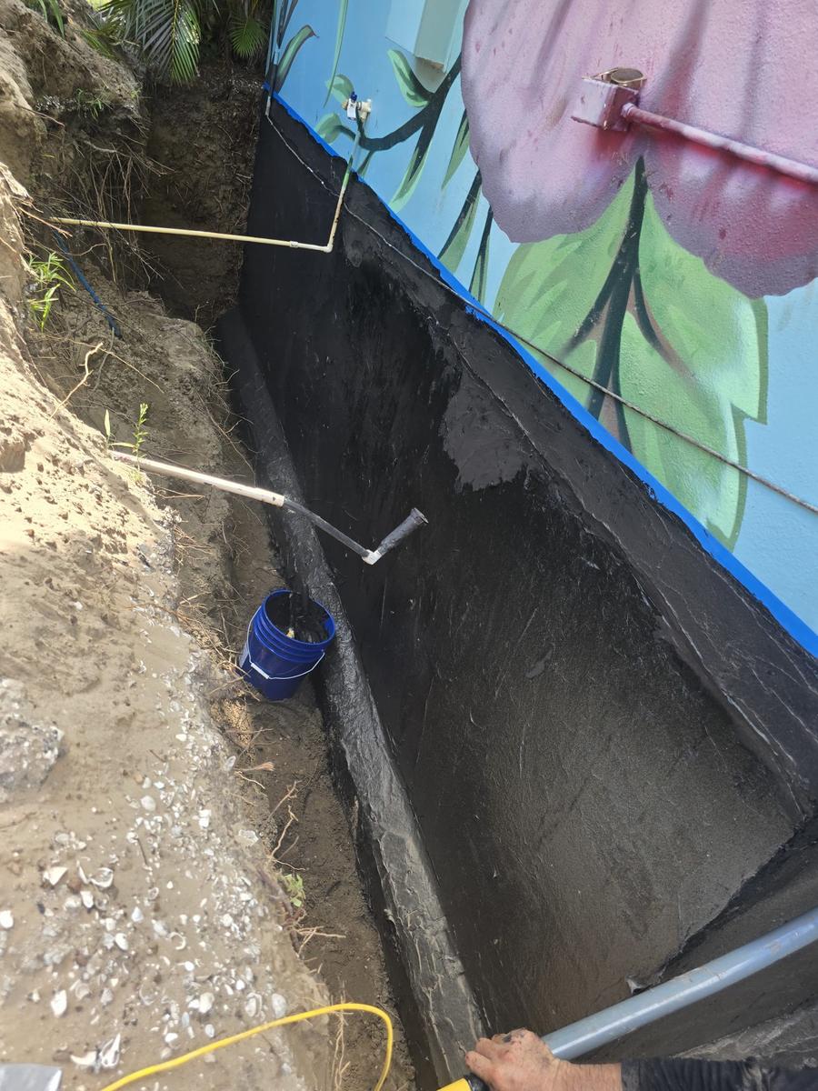 Yard drainage installation on a sloping Lithia FL property